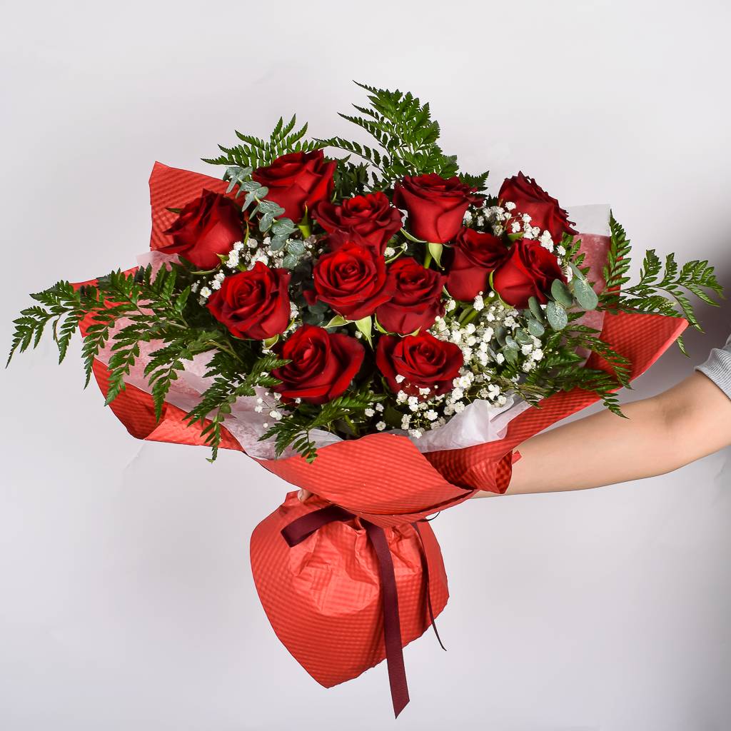 Fresh 12 Red Roses Hand Wrapped In Red Textured Floral Paper