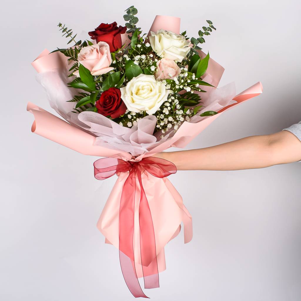 Korean Paper Wrapped rrangement With 6 Red, White And Pink Roses With Lush Greenery