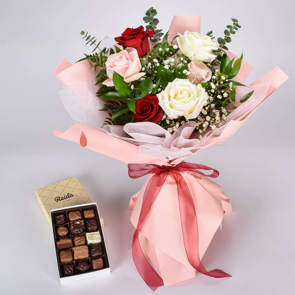 Reids Assorted Milk, Dark And White Chocolate Box With White, Red And Pink Roses Wraped In Pink Korean Paper