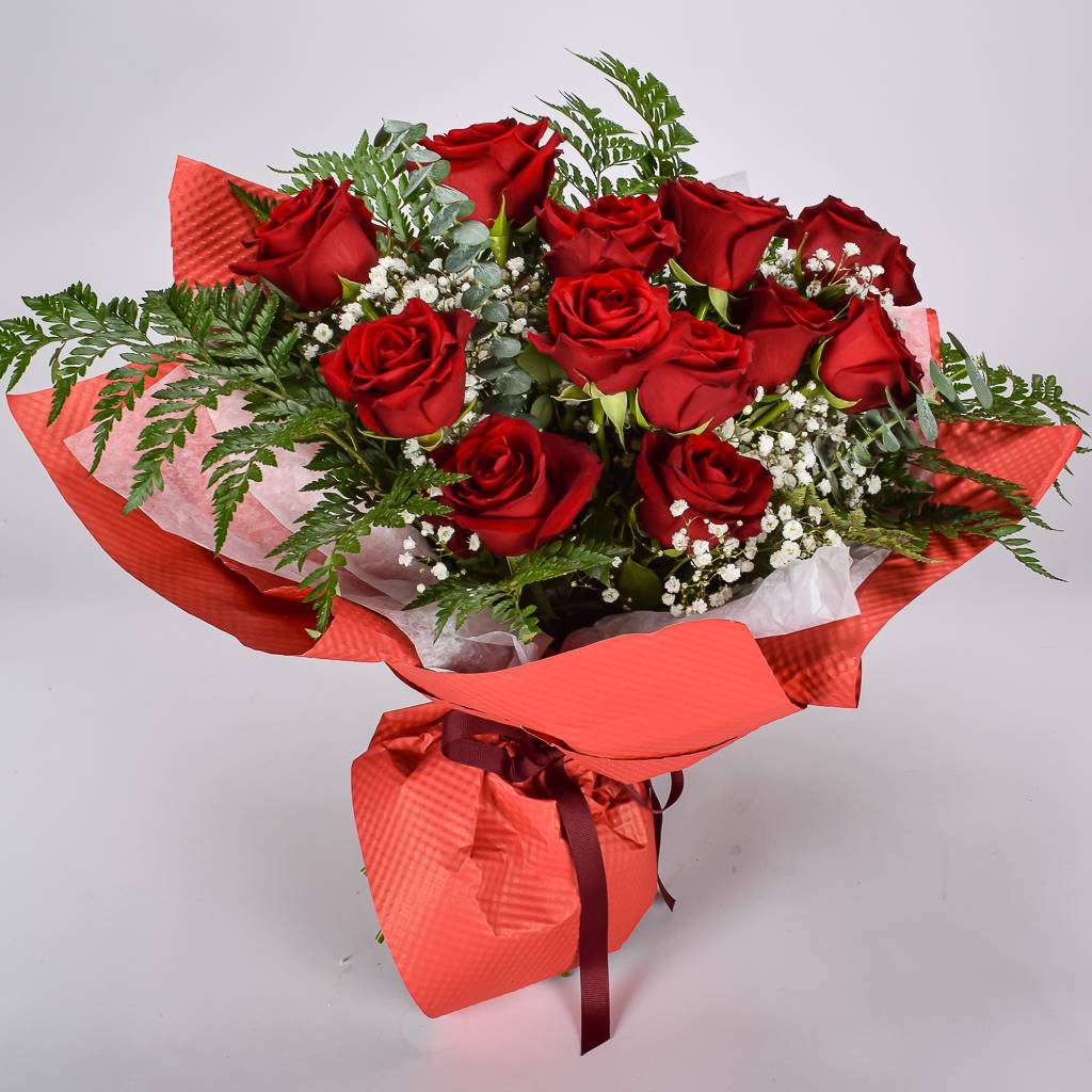 Fresh 12 Red Roses Hand Wrapped In Red Textured Floral Paper
