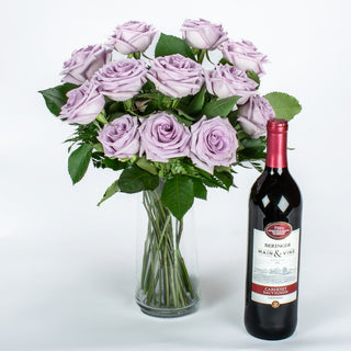 A Dozen Lavender Roses In Vase With Wine