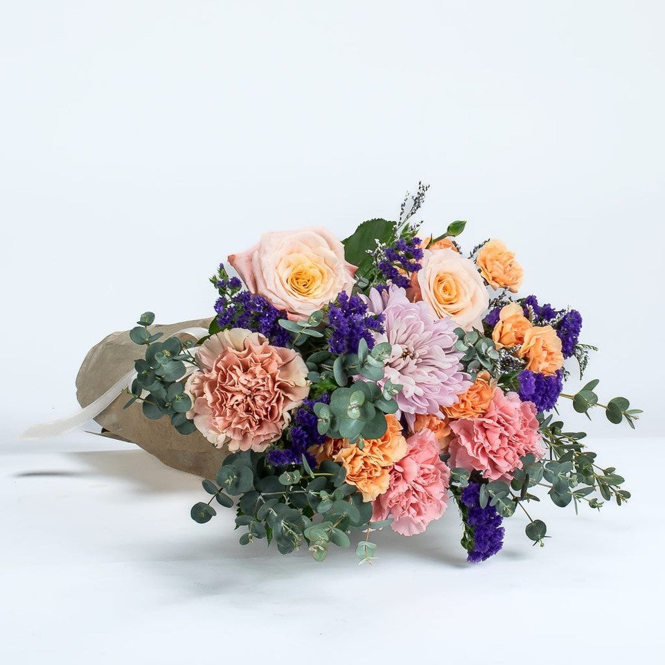 Peach Roses And Assorted Flowers